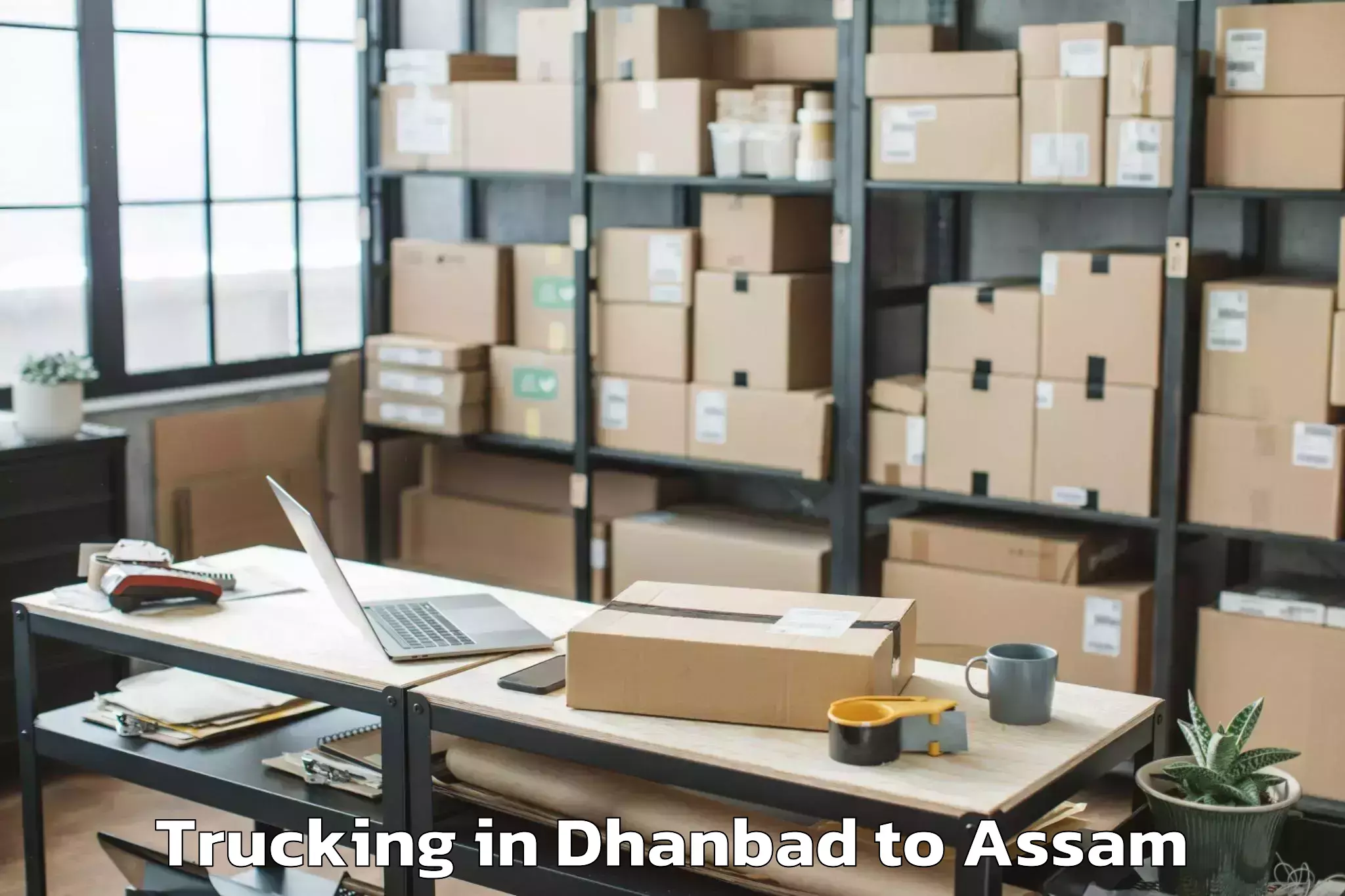 Top Dhanbad to Chaparmukh Trucking Available